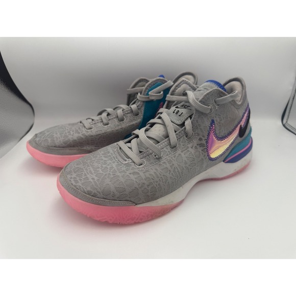 gray nikes with pink swoosh